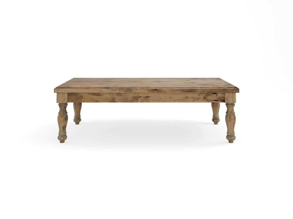 The Abigail Coffee Table - Harvest Wheat by James+James features a rustic wooden design with a rectangular top and four turned legs. The wood showcases a natural, weathered finish, adding to its vintage charm. The table is photographed against a plain white background.