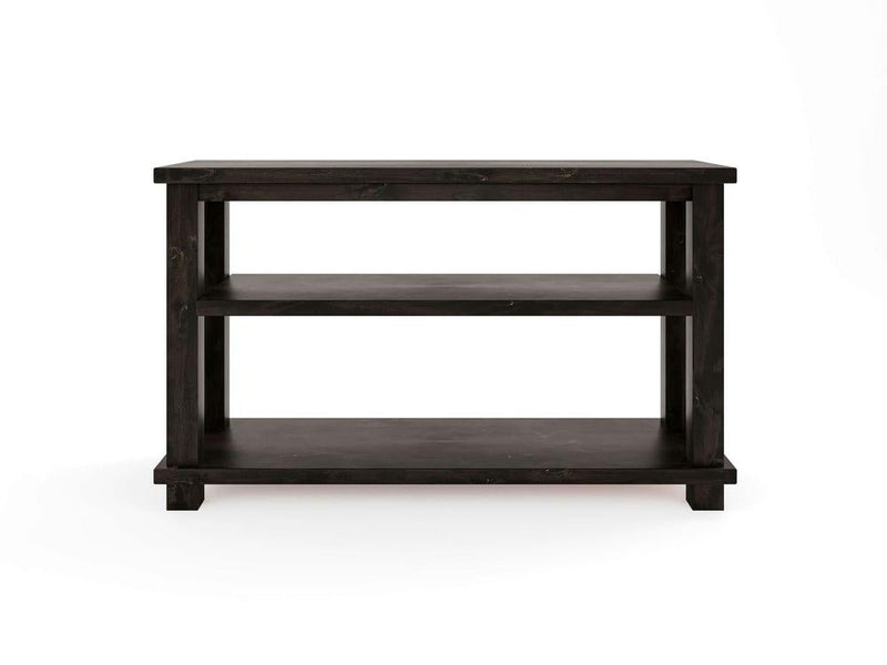 Introducing the Carter X Sofa Table in Charred Ember by James+James: a side table crafted from black wood, showcasing a rectangular top and two spacious shelves below. This minimalist design features clean lines and square legs, perfectly set against a plain white background.