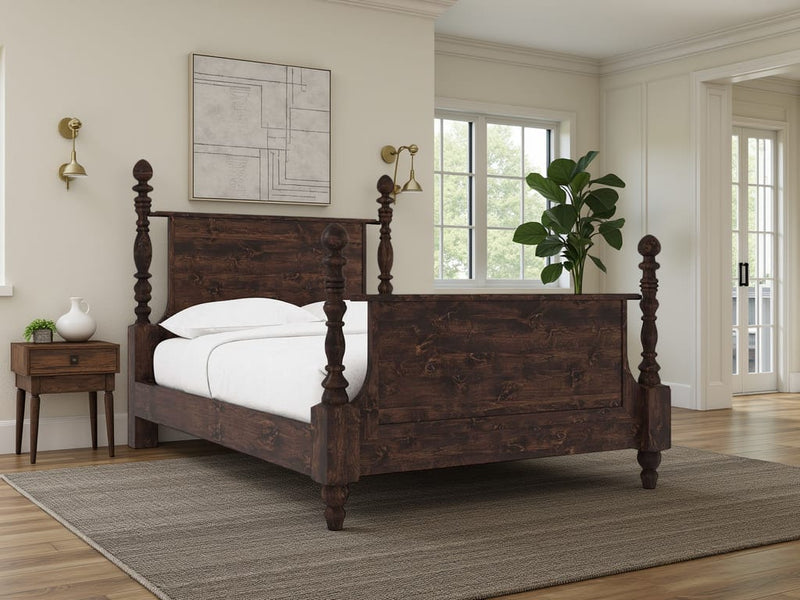 A bedroom featuring the James+James Catherine Bed in Tobacco, white bedding, a wooden nightstand with lamp, wall-mounted abstract art, a potted plant, and large windows bathing the space in natural light.