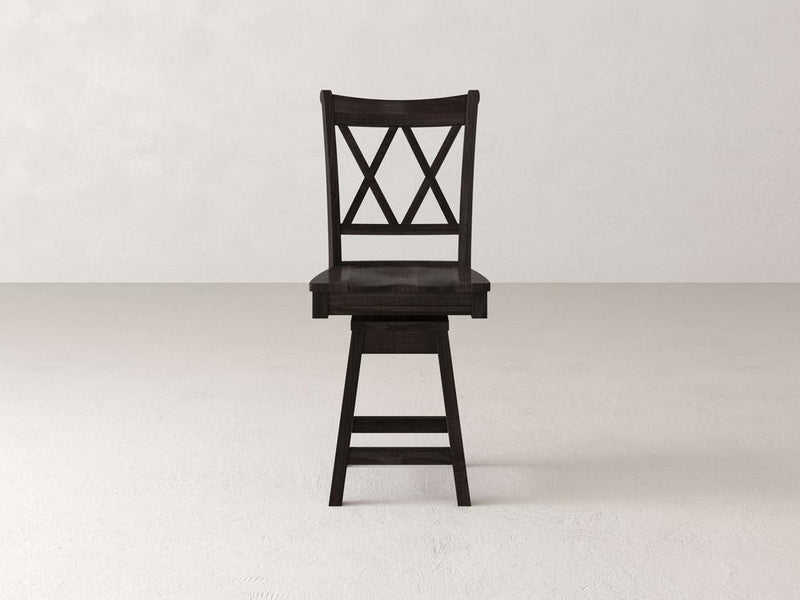 The James & James Double X Back Swivel Stool showcases timeless elegance with its dark wood finish, square seat, and double X-back slats. It stands on four legs connected by horizontal supports and sits gracefully on a light surface.