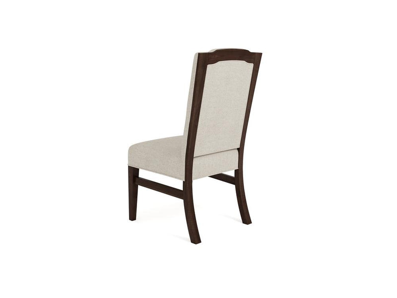 Wooden chair with off-white upholstered seat and backrest, shown from the back and side angle. The frame has a dark finish with gently curved legs and a slightly arched top.