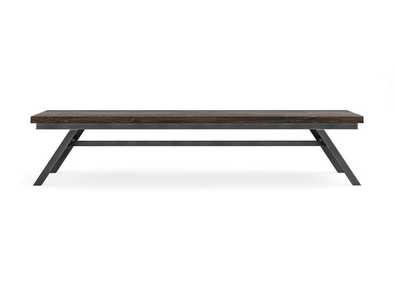A rectangular wooden bench named the Fulton Bench - Tobacco by James+James features a dark wooden top and angled black metal legs. The design is minimalist and modern, with a sturdy frame and a smooth surface. The bench is placed against a white background.