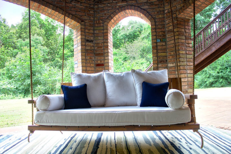 Maisie Wood Porch Swing Bed Daybed, Twin Size, in Harvest Wheat Finish. Pictured with our Sketched Indoor / Outdoor Rug.