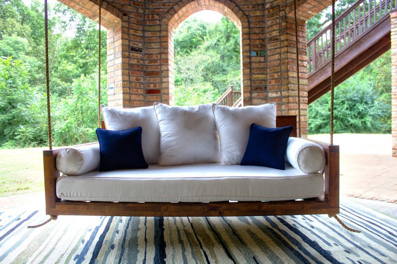Avery Wood Porch Hanging Swing Daybed in Tuscany Finish. Twin Mattress Size. Pictured with the Sketched Indoor / Outdoor Rug.